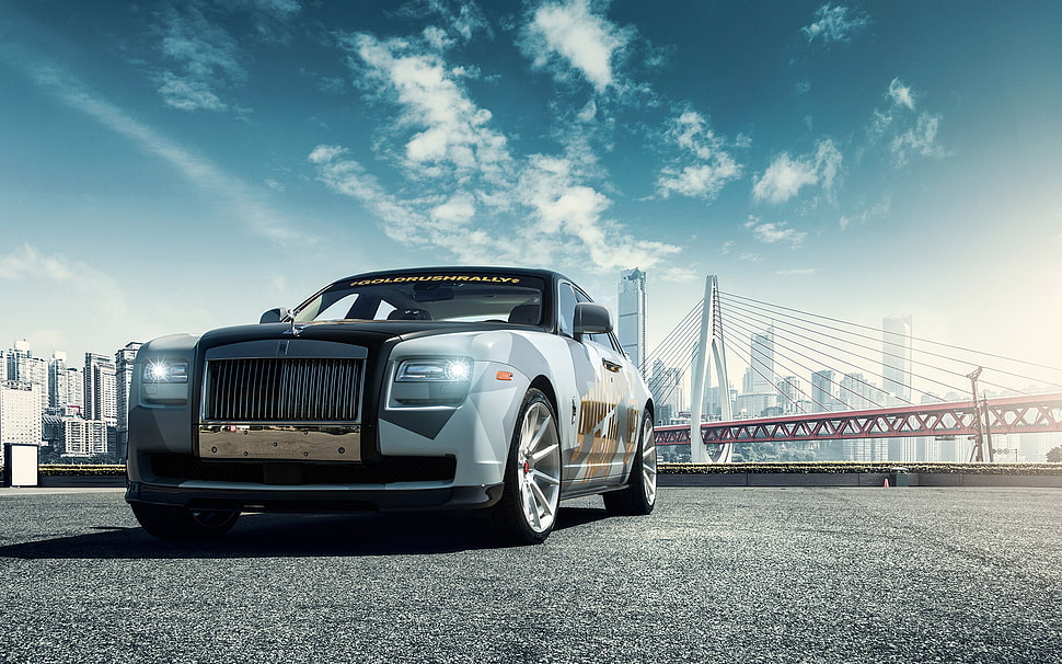 silver Rolls Royce car near suspension bridge HD wallpaper
