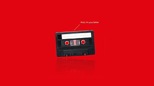 black cassette tape, cassette, simple, text, red background