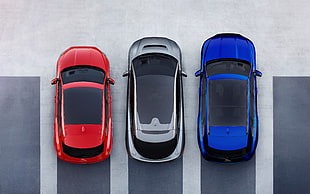 red, silver, and blue cars