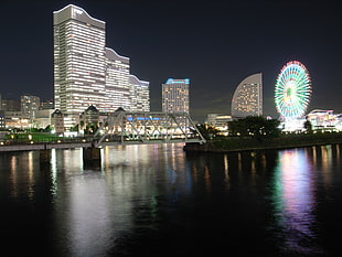beige lighted concrete buildings near sea during night time, yokohama HD wallpaper