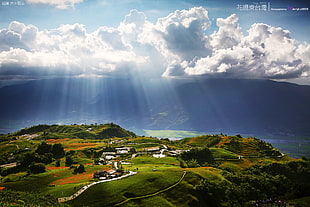 areal photography of town with cumulus nimbus clouds and god rays, taiwan