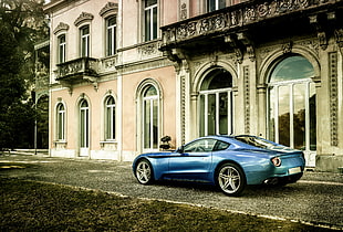 blue sports coupe near concrete building during daytime HD wallpaper