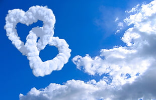 white clouds form into heart chain