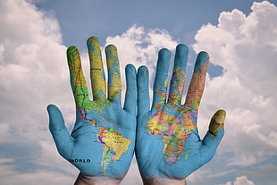 world map on person's hand HD wallpaper