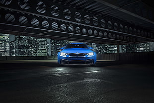 blue BMW sedan