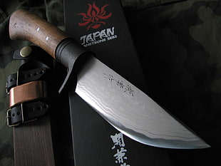 brown handled kaji script embossed knife