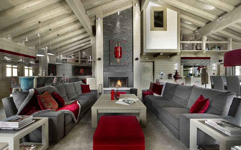 rectangular brown wooden table between two gray fabric sofas in front of fireplace HD wallpaper