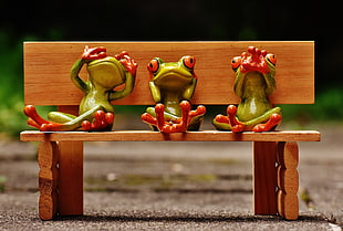three green frog in bench figurines