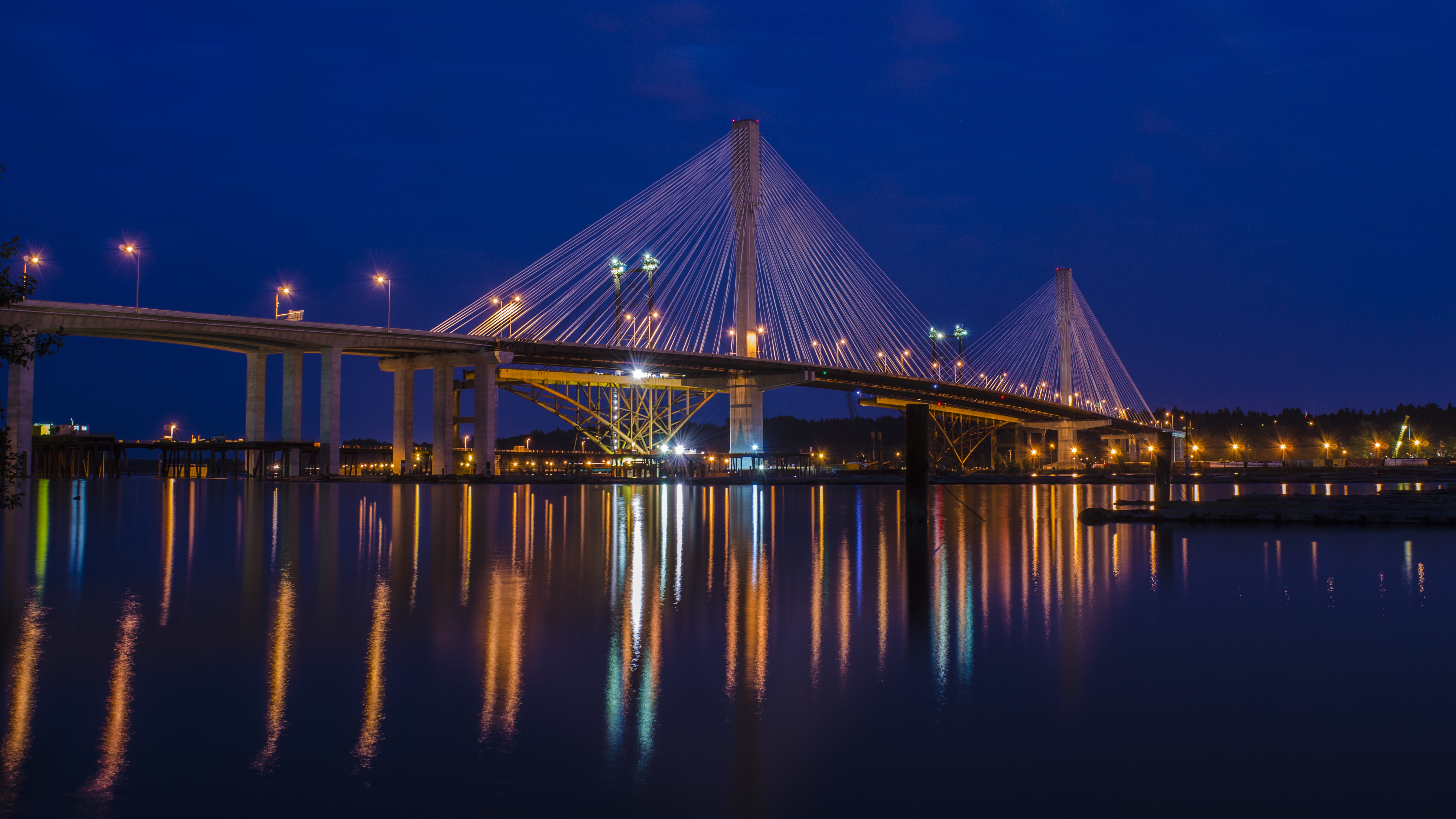 lighted bridge during nighttime, port mann bridge