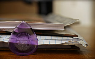 selective focus of purple glass bottle HD wallpaper