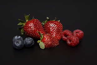red strawberries, raspberry and blackberries