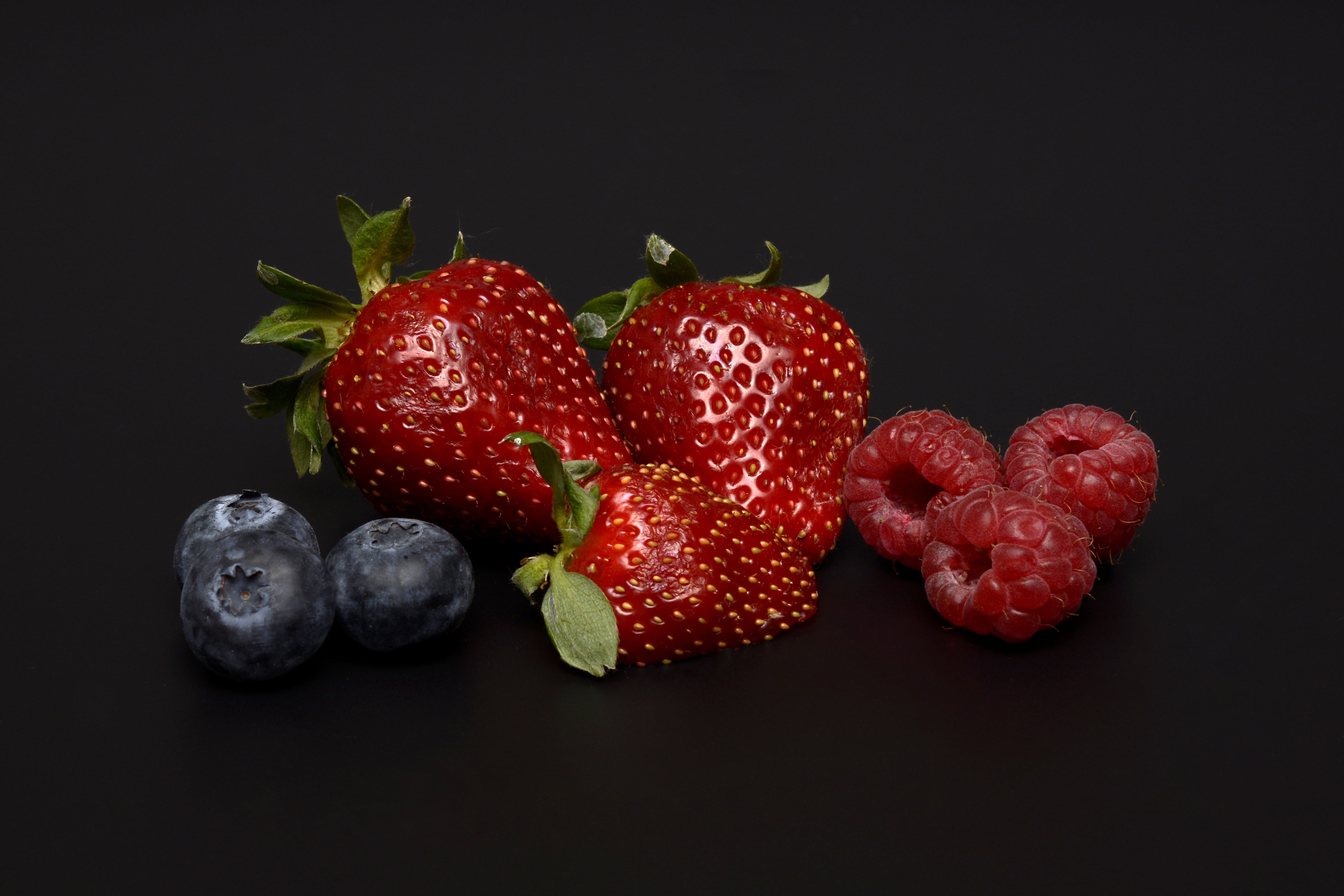 red strawberries, raspberry and blackberries