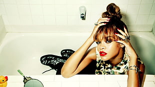 Rihanna sitting in bathtub
