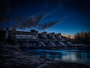 silhouette photography of gray concrete dam