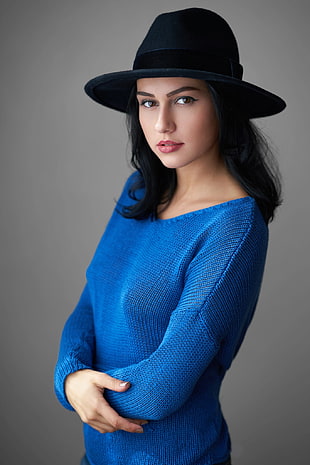 woman wearing blue knitted sweatshirt