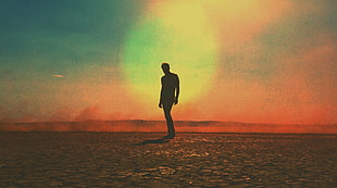 silhouette of man on desert during daytime