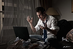 man wearing white dress shirt with black necktie seating on black seat HD wallpaper
