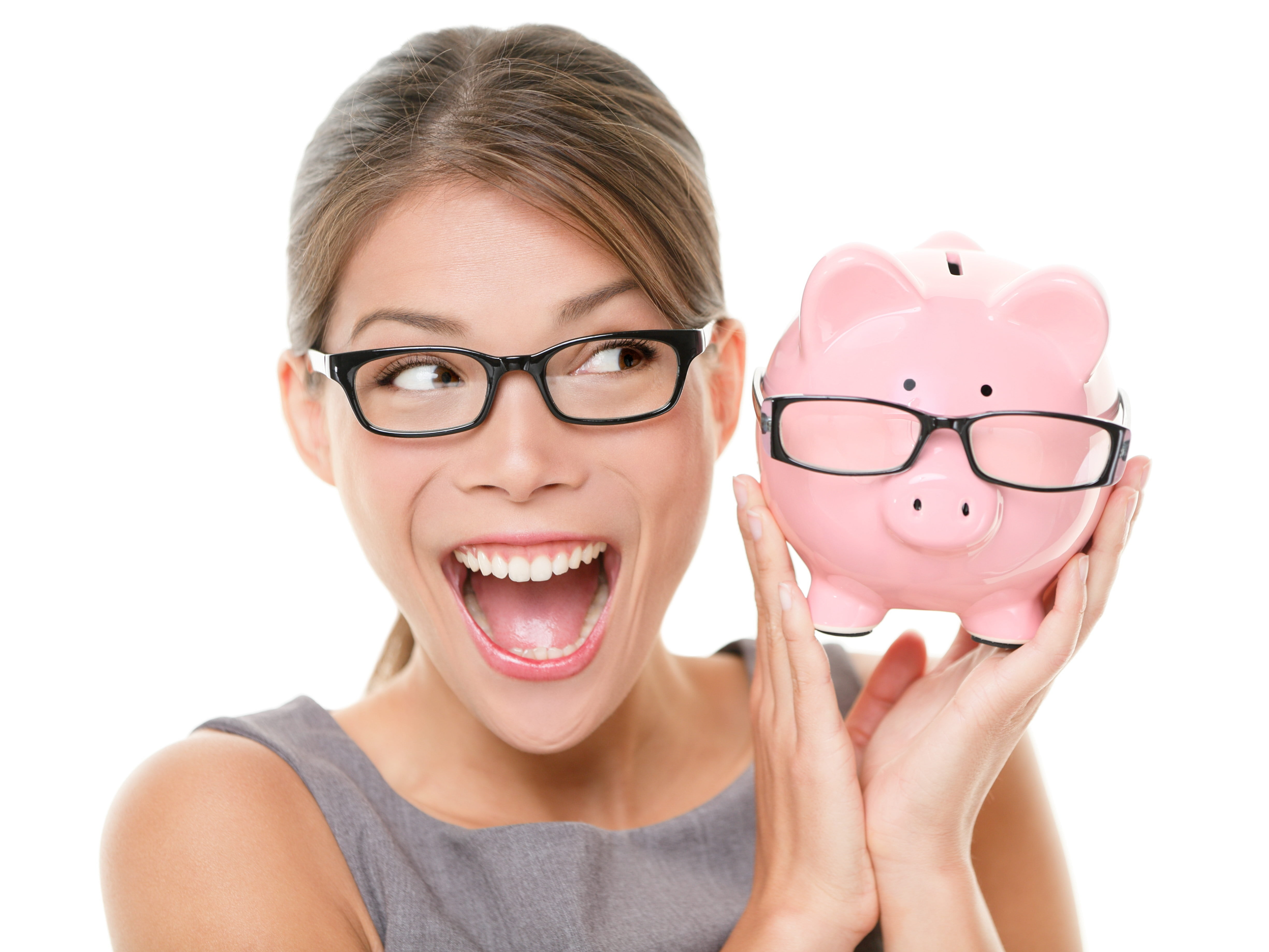 woman wearing black framed eyeglasses holding pink piggy bank