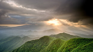 green mountain, hills, alone, clouds, sun rays HD wallpaper