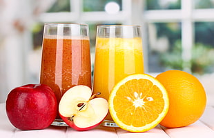 two orange and apple juices