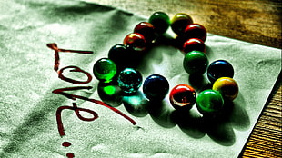 beaded green, red, and blue bracelet, love, beads, marble
