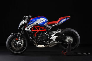 red, blue, and gray naked motorcycle