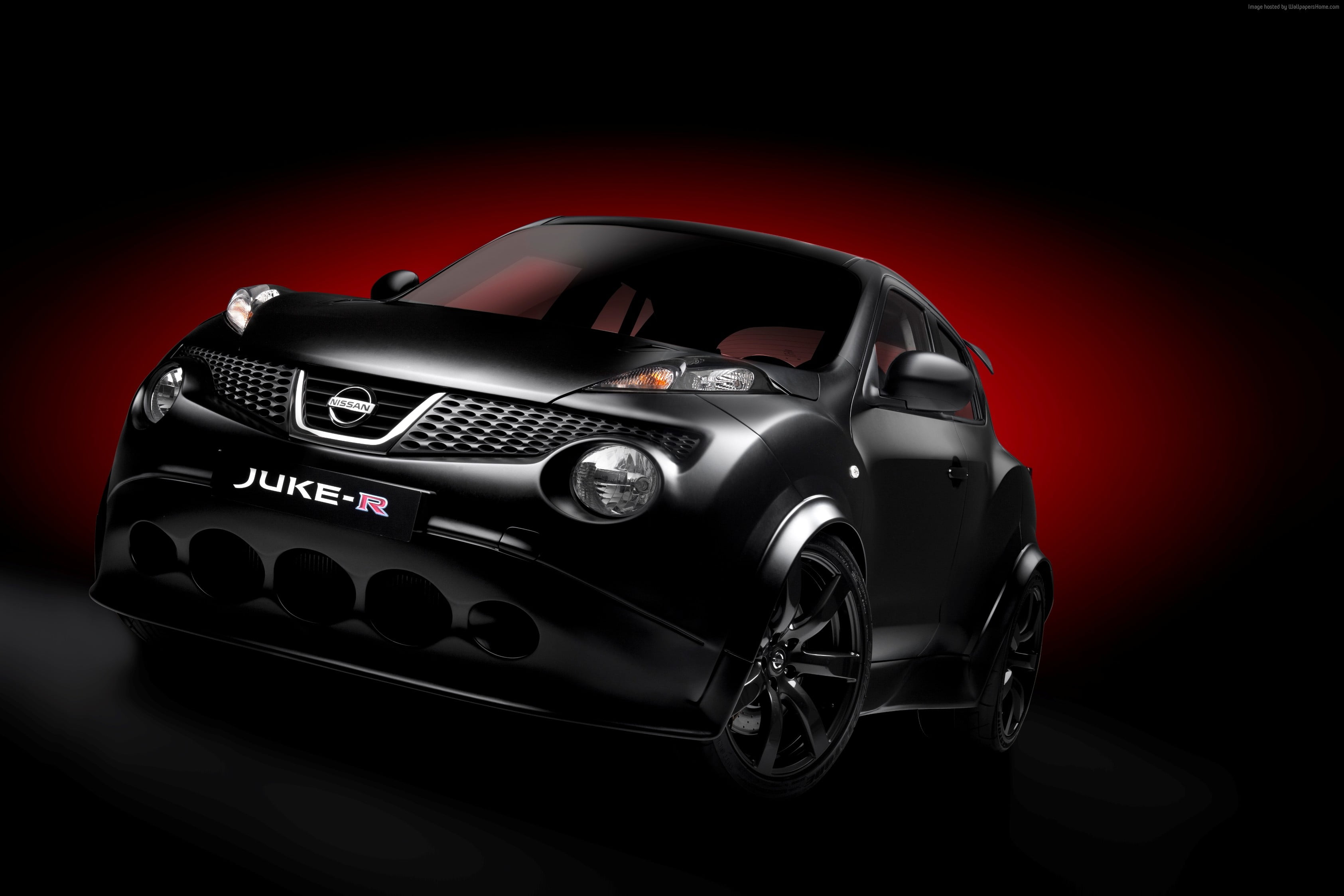 black Nissan Juke-R with black and red background