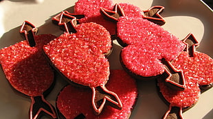 six red Heart-shape decorations