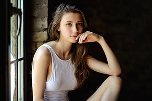 woman wearing white sleeveless top