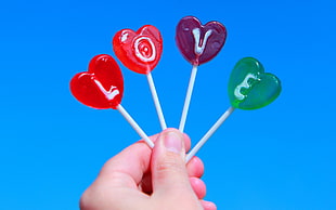 four assorted-color lollipops, love, candies