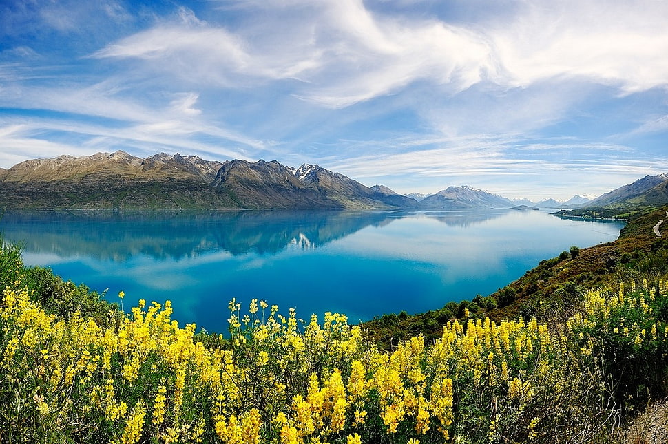 landscape photography of lake surrounded by mountains HD wallpaper