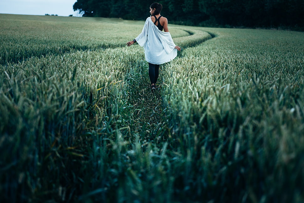 photo of woman walking on grass path HD wallpaper