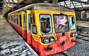 abandoned red and yellow tram numbered 4609 on station at daytime