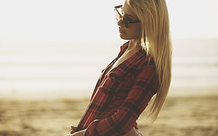 blonde hair woman in red and black dress shirt and sunglasses during daytime