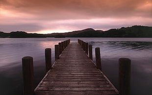 rectangular brown wooden table with six chairs dining set, dock, sunset, water