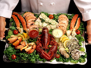 assorted seafood on rectangular silver platter
