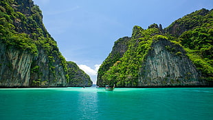 green and gray rocky islands with boat sailing on body of water during daytime, Thailand, Thai, sea, sky