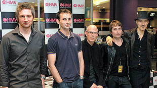 group of five men wearing black top
