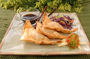 fried food with sauce and sliced vegetables