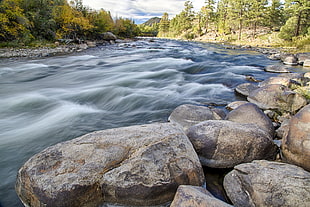 time lapse photo of river with stones during daytime, browns HD wallpaper