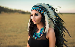white native American headdress, dark hair, headdress, black clothing, blue