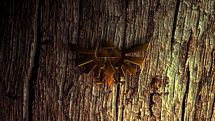 gold eagle badge on tree stem wallpaper