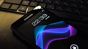 black Samsung Galaxy Android smartphone on table