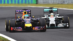 two F1 vehicles, Formula 1, motorsports, Sebastian Vettel, Lewis Hamilton