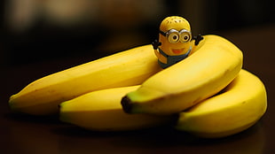Minion toy and yellow banana fruit HD wallpaper