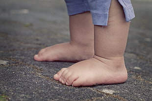 close up photo of baby's feet