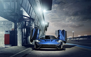 photo of blue Ford GT on roadway
