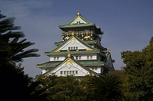white and green pagoda under blue sky