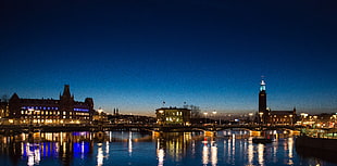 high-rise buildings near body of water during nighttime, stockholm HD wallpaper
