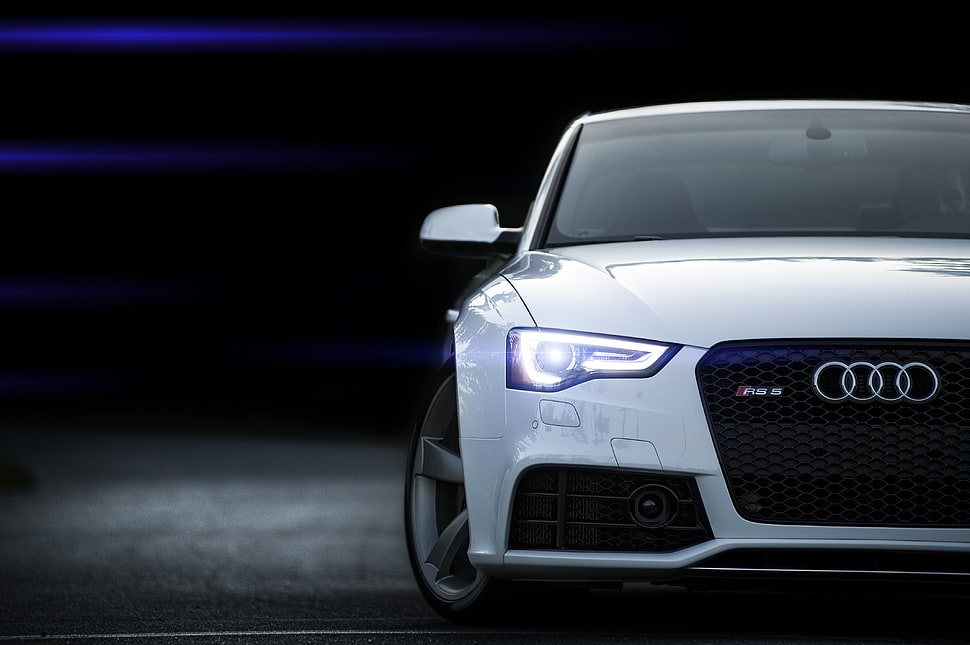 white Audi car on gray concrete floor HD wallpaper